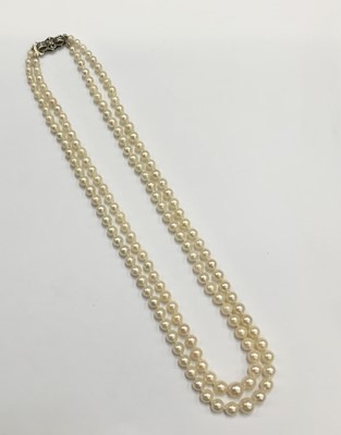 Lot 203 - Cultured pearl two strand necklace with two strings of graduated cultured pearls measuring approximately 3.9mm-8.1mm diameter on a silver clasp. Length approximately 47cm