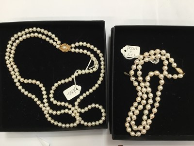 Lot 206 - Two cultured pearl necklaces with gold clasps, one with two strands of 5.5-6mm freshwater cultured pearls on a 9ct gold clasp, 50cm length, the other with a single string of 6.5mm cultured pearls o...
