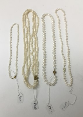 Lot 213 - Four cultured pearl and freshwater cultured pearl necklaces, one with 18ct gold clasp, the others with gilt metal clasps