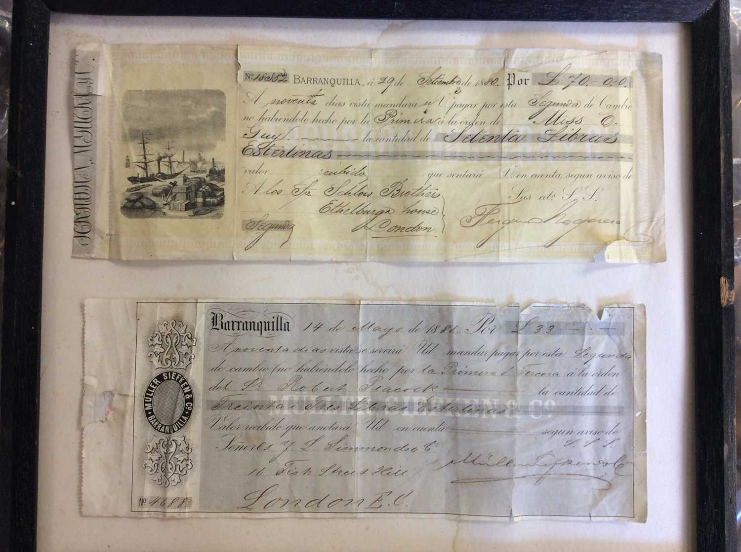 Lot 402 - Two Colombian cheques mounted in frame