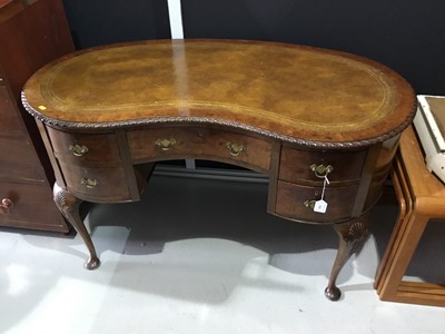 Lot 133 - Queen Anne revival walnut and leather topped kidney shaped desk
