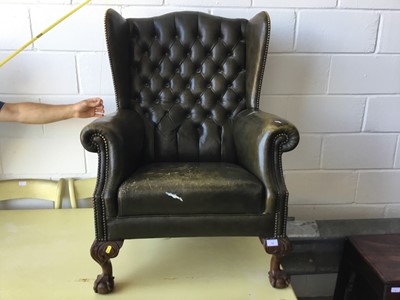 Lot 14 - Leather button upholstered wingback armchair