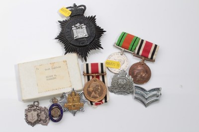 Lot 609 - Second World War Defence medal, together with a George VI Special Constabulary Long Service medal named to Owen E. Long (mounted on bar) together with an Elizabeth II Special Constabulary Long Serv...