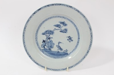 Lot 21 - 18th century Chinese famille rose porcelain plate, an 18th century Chinese blue and white plate, and a 19th century Canton plate (3)
