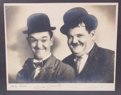 Lot 1109 - Autographs - Stan Laurel (1890-1965) & Oliver Hardy (1892-1957) signed photograph "Hello Joan!", signed in pen