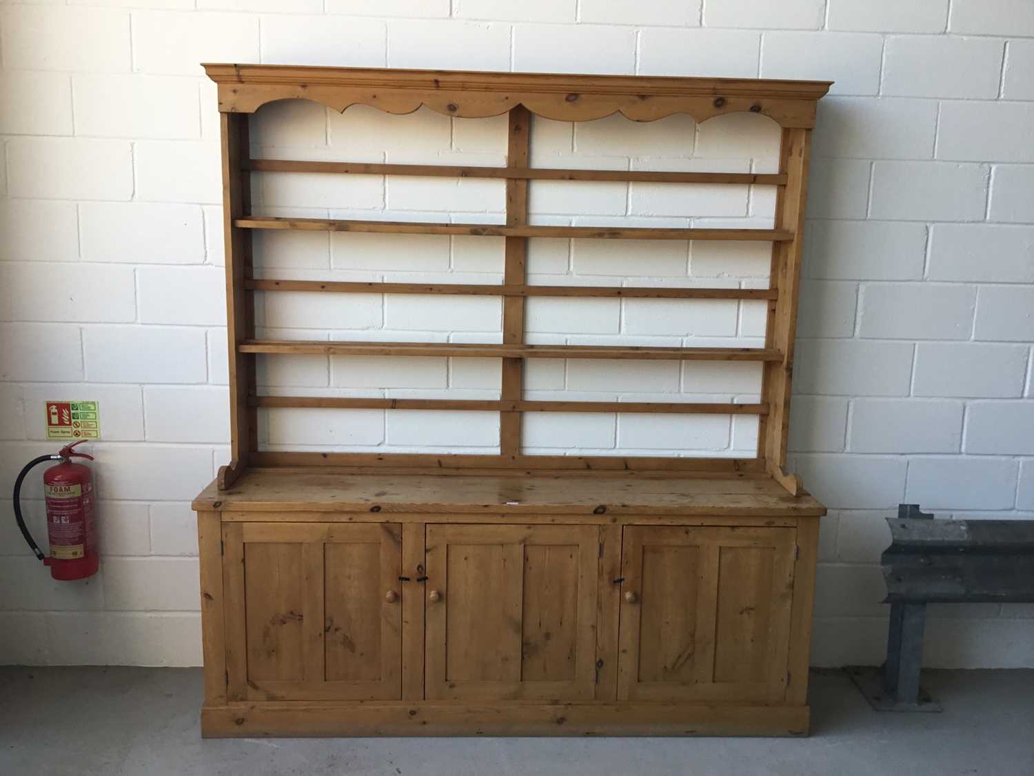 Lot 1 - Antique pine two height dresser, with open shelves above with three panelled doors below, 215cm long, 227cm in overall length, 52cm deep