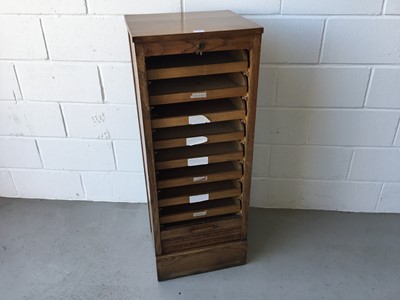Lot 5 - Edwardian oak stationary / filing cabinet with nine sliding shelves, enclosed by tambour shutter door, 47cm width, 118cm height, 40cm depth