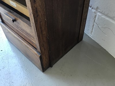 Lot 5 - Edwardian oak stationary / filing cabinet with nine sliding shelves, enclosed by tambour shutter door, 47cm width, 118cm height, 40cm depth