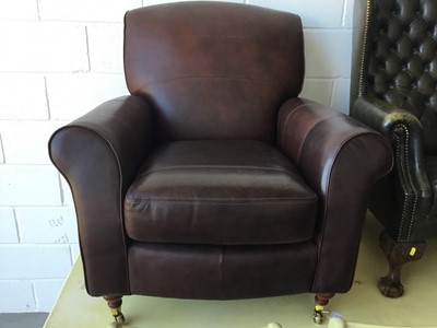 Lot 15 - Good quality contemporary brown leather arm chair by Marks & Spencer, on turned feet with brass castors, 93cm in overall height