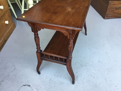 Lot 17 - Edwardian Mahogany two tier occasional table with turned fluted column and legs on brass and ceramic castors, 114cm length, 74cm height, 48cm depth