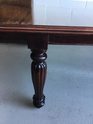 Lot 30 - Victorian mahogany extending dining table (with one extra leaf) on turned legs with fluted decoration (no winding handle present) 268cm in length, 121cm in width, 77cm in height