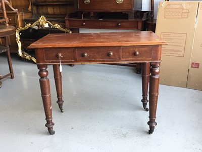 Lot 65 - Victorian mahogany writing table, with three draws on turned legs with brass castors, 94cm in length, 76cm in height, 51cm depth
