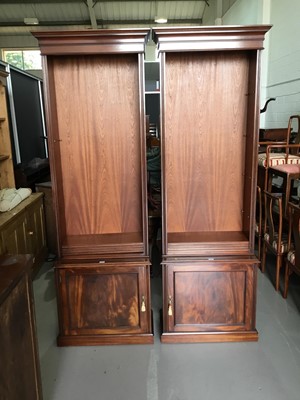Lot 52 - Pair of large good quality reproduction regency style two height mahogany book cases, with adjustable shelves above single panelled door, each 74cm wide, 229cm high, 38cm deep