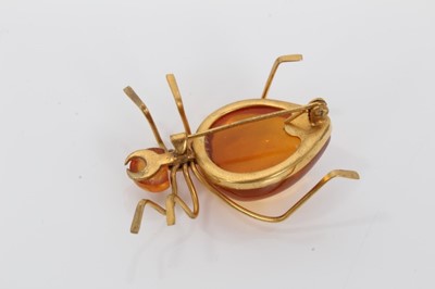Lot 453 - Amber spider brooch and an amber bracelet