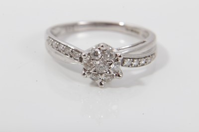 Lot 457 - Diamond cluster ring with a daisy flower head cluster of seven brilliant cut diamonds in 9ct white gold setting