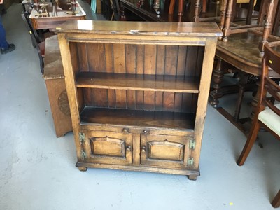 Lot 80 - Manner of Titchmarsh & Goodwin- Good quality reproduction oak narrow bookcase of small proportions, single shelf to interior and pair of panelled doors below, 80cm in length, 97cm in height, 25cm i...