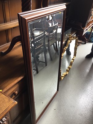 Lot 94 - Antique style gilt framed wall mirror with shell and scroll decoration together with another mirror in plain rectangular frame, gilt mirror 106cm x 80cm, other mirror 73cm x 134cm (2)
