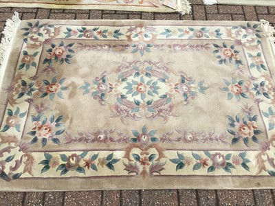 Lot 103 - Three Chinese wash rugs with floral decoration, measuring 146 x 68cm, 190 x 95cm and 187 x 124cm (3)