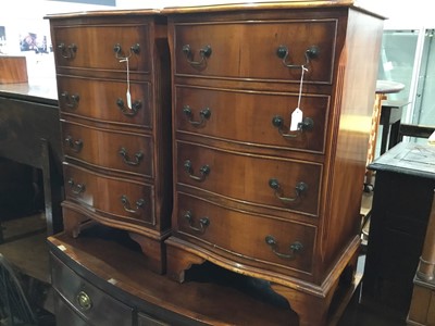 Lot 118 - Pair of reproduction Georgian style walnut serpentine fronted bedside chests with four draws, on bracket feet, each 47cm x 76cm x 36cm