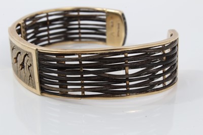 Lot 445 - 9ct gold African bracelet