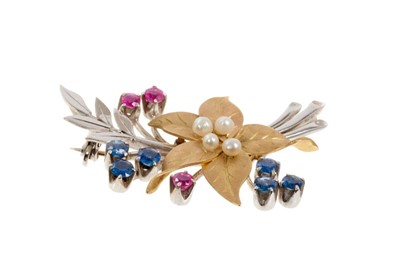 Lot 438 - 9ct white and yellow gold floral spray brooch decorated with four seed pearls, six sapphires and three rubies
