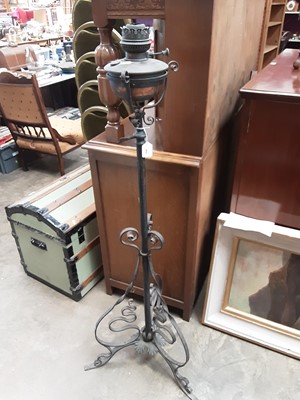 Lot 95 - Early 20th century oil lamp on metal stand