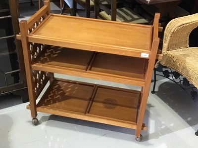 Lot 154 - Unusual teak tea trolley with gothic style pierced sides, and removable trays, on castors, 75 x 76 x 40cm