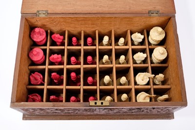 Lot 728 - 19th century Chinese Canton carved ivory chess set, housed in a fine carved oak fitted box