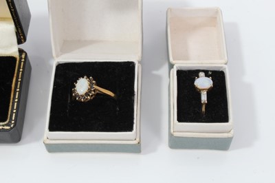 Lot 67 - Four 9ct gold opal dress rings
