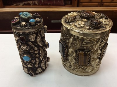 Lot 704 - Two Eastern white metal gem set canisters