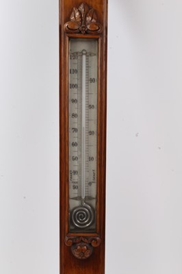 Lot 621 - Late Victorian oak carved barometer