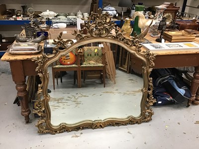 Lot 943 - Ornate gilt framed over mantel mirror