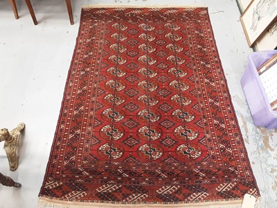 Lot 1012 - Eastern rug with geometric decoration on red ground