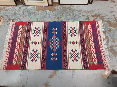 Lot 1013 - Kelim rug with blue and white decoration together with another eastern rug on cream and blue ground (2)