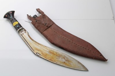 Lot 703 - Gurkha Kukri with steel blade, makers mark indistinct, in brown leather covered sheath