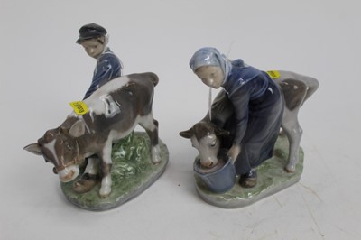 Lot 579 - Two Royal Copenhagen figures - Girl and Boy feeding calves