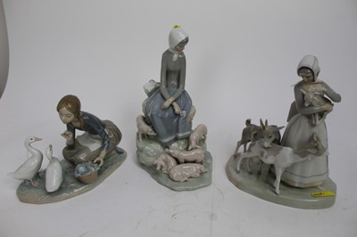 Lot 879 - Three Lladro figures - girl with pigs, girl with goats and girl with geese