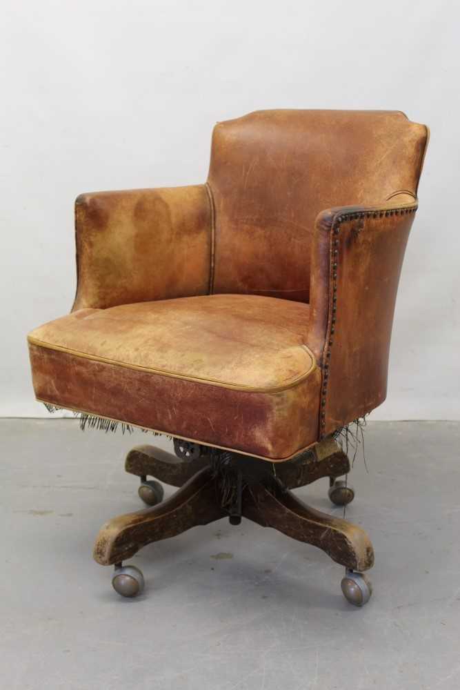 Lot 1249 - Early 20th century leather swivel desk chair