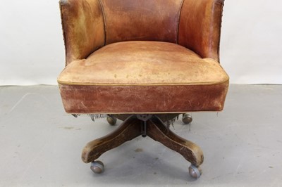 Lot 1249 - Early 20th century leather swivel desk chair