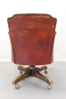 Lot 1249 - Early 20th century leather swivel desk chair