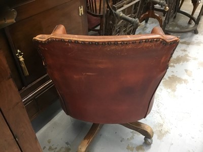 Lot 1249 - Early 20th century leather swivel desk chair