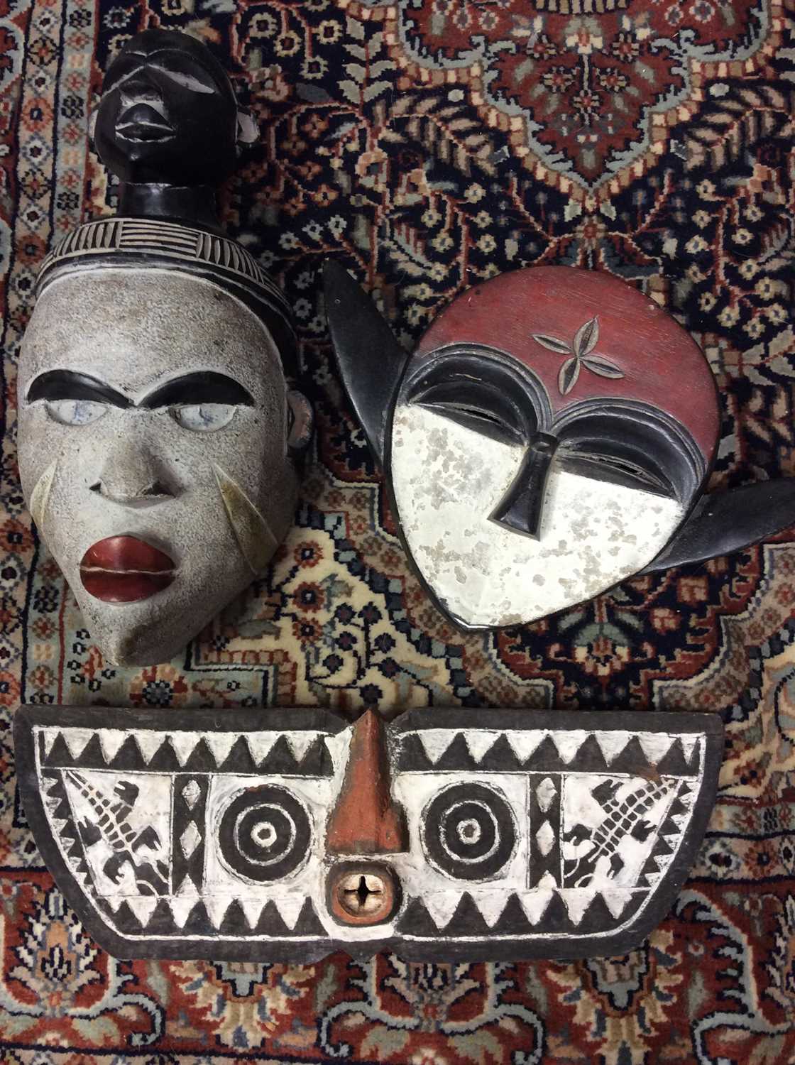 Lot 410 - Three carved wood tribal masks