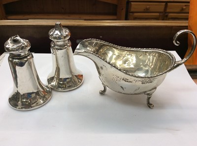 Lot 681 - Silver sauce boat and pair silver salt and pepper castors