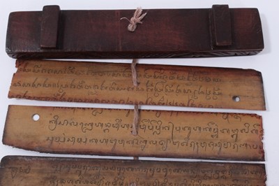 Lot 747 - Antique Tibetan prayers strips with carved hardwood casing