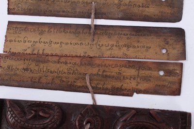 Lot 747 - Antique Tibetan prayers strips with carved hardwood casing