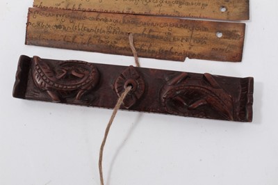 Lot 747 - Antique Tibetan prayers strips with carved hardwood casing