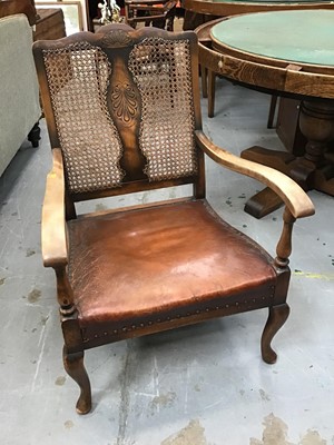 Lot 1000 - 1920s Bergere elbow chair with caned back and brown leather seat, together with a 1920s mahogany and Bergere magazine rack