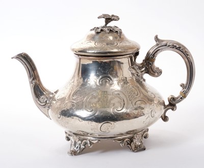 Lot 244 - Victorian silver teapot with engraved foliate scroll decoration