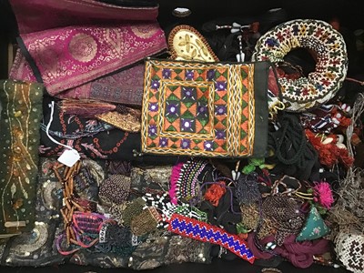 Lot 1808 - Two boxes Eastern fabrics, beaded items, small purses, embroidered fabrics and linens