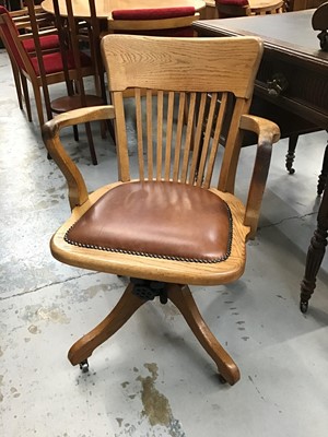 Lot 929 - 1930s oak and leather swivel desk chair